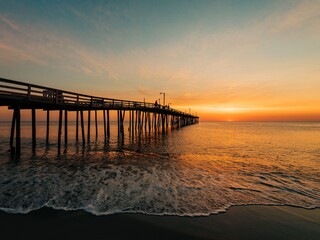 Fototapeta na wymiar Nags Head Pier at sunrise, in the Outer Banks, North Carolina
