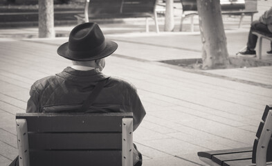 black and white photo of a lonely old person 