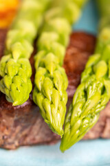 asparagus with potatoes and a steak