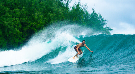 Man Surfing Tropical Wave