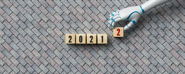 robot hand adding a cube changing the message 2021 to 2022 on stone pavement background