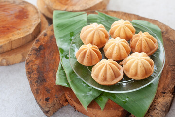 Sponge cake baked in special aluminium moulds also called Kueh Bolu or Kuih Bahulu is the Asian tradition food in popular Malaysia and Indonesia.
