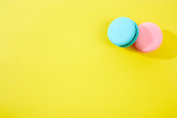 French macaroon biscuits on colorful background