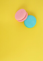 French macaroon biscuits on colorful background