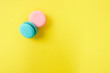French macaroon biscuits on colorful background