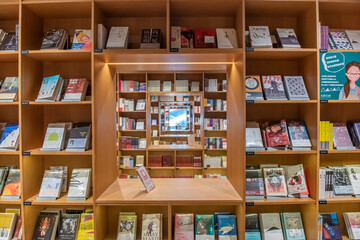 Background from brown bookshelves with books. Learning and education concept.