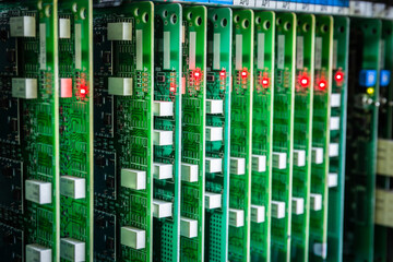 PBX phone motherboard with a flashing light indicating the digital connection status. Select focus