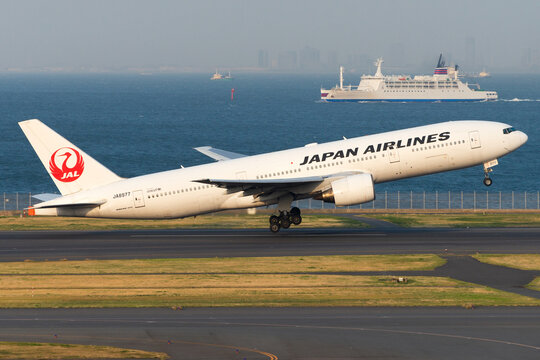 Japan Airlines Boeing 777 taking off from Haneda Airport in Tokyo, Japan. JAL B777 aircraft registered as JA8977