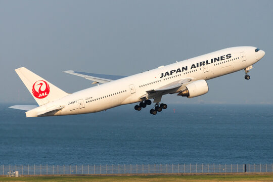 Japan Airlines, also know as JAL, Boeing 777 departing Tokyo Haneda Airport. Aircraft registered as JA8977 operating domestic flight in Japan.