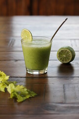 celery drink with lime and spoon on the table