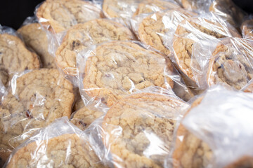 A view of a tub full of packaged chocolate chip cookies.