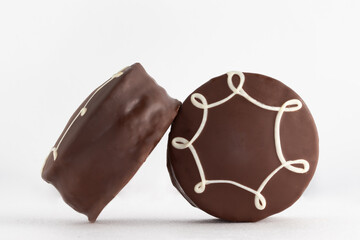 Honey cookies with chocolate on white background.