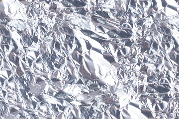 A view of a background of aluminum foil wrinkles.