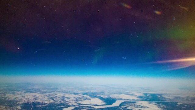 Aurora Borealis from a plane over the earth