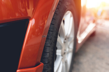 An orange car accident, scratching the front bumper. Must quickly claim the insurance to make it...
