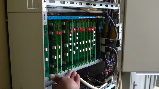 PBX phone motherboard with a flashing light indicating the digital connection status