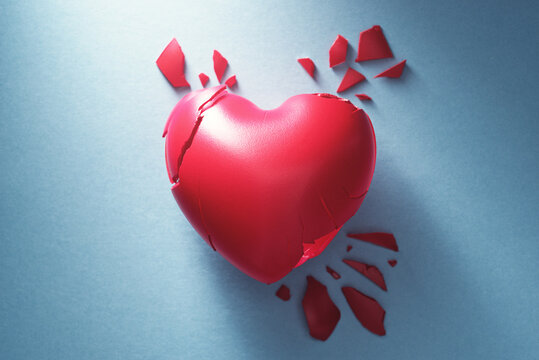 Broken heart on blue background. Lost love and mental disorder image.