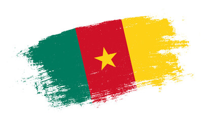 Flag of Cameroon country on brush paint stroke trail view. Elegant texture of national country flag