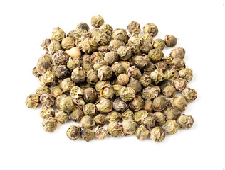 pile of green pepper peppercorns closeup on white