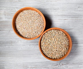 rye groats and grains in round ceramic bowls