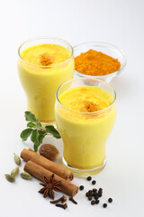 Golden milk with milk, turmeric, cinnamon, ginger ,black pepper, honey for healthy drink