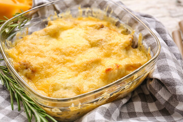 Baking dish with tasty julienne on table, closeup