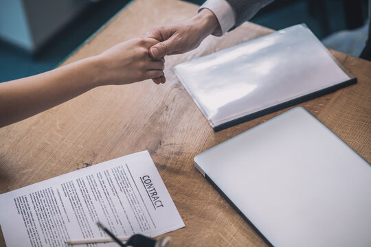 Hands of two business partners in handshake