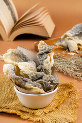 salmon fish skin or crispy fish skin. 
The skin is evenly coated with seasoning, marrying sweet, salty and savoury in one bite - resulting in a balanced of flavour. 