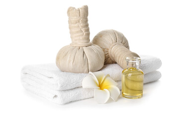 Fototapeta na wymiar Clean towels, spa herbal bags and essential oil on white background