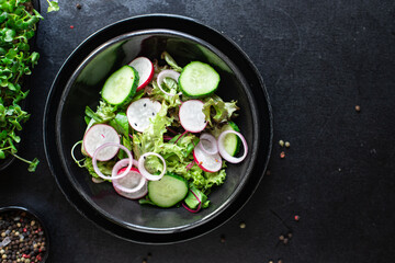 salad vegetable radish, cucumber, green mix leaves veggie meal snack diet vegan or vegetarian food copy space food background rustic top view