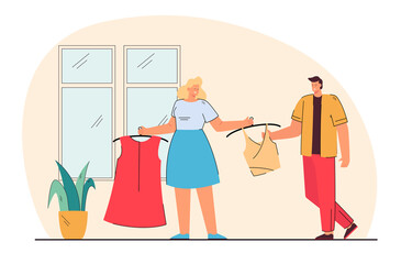 Woman showing new clothes to man. Wife showing new top and dress to husband. Clothes shopping. Shopping concept for banner, website design or landing web page