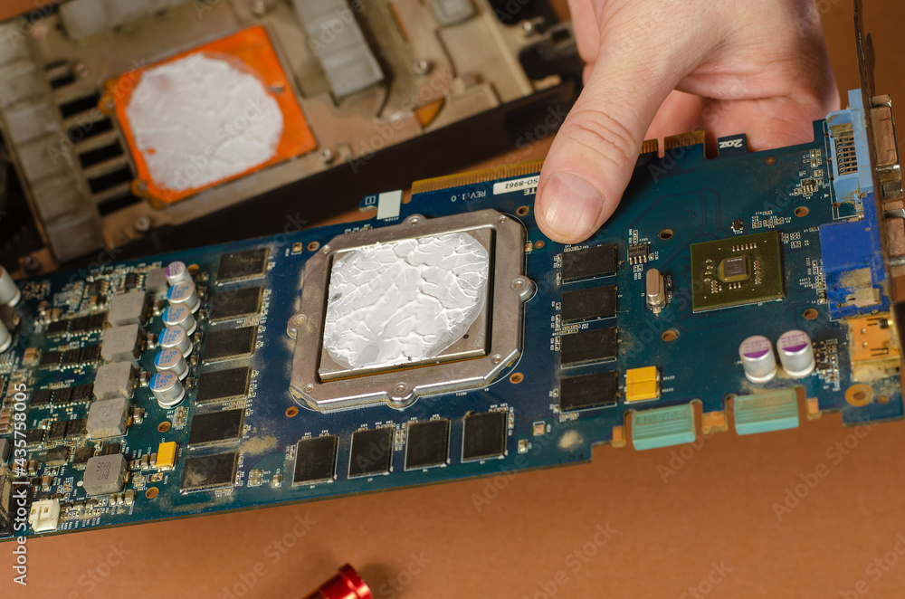 Poster computer repair services and components concept. a man is holding a disassembled computer graphics c