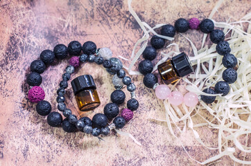 Bracelet made of lava with natural stones. Handmade jewelry bottle with essential oils.
