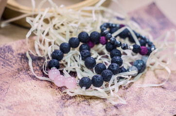 Bracelet made of lava with natural stones. Handmade jewelry bottle with essential oils.