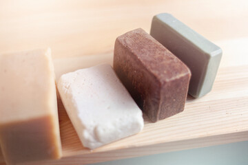 Home made soap bars displayed beautifully with soft dream lighting.