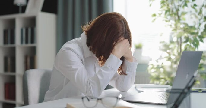 Woman tired from laptop work