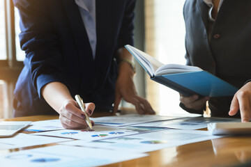 A business advisor explains graphs statistics and ways to increase profits this quarter