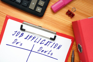 Business concept meaning JOB APPLICATION Do's and Don'ts with inscription on the sheet.
