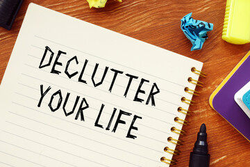 Business concept meaning DECLUTTER YOUR LIFE question marks with inscription on the page.