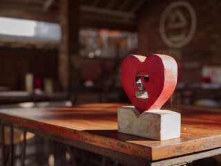 Heart shaped cafe table number. Food ordering, service sector.