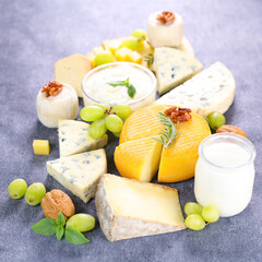 assorted of dairy products on wooden board
