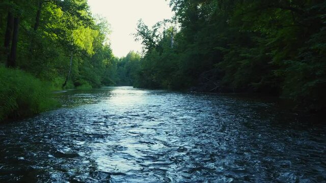 Rafting on the forest river on beautiful sunny summer days. Unique natural locations far from civilization.
Vacation on the forest river. A stormy river with rapids in the middle of the forest. 