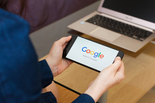 SAN FRANCISCO, US - 22 April 2019: Close up to female hands holding smartphone using Google Search Console Service, San Francisco, California, USA. An illustrative editorial image