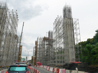 SEREMBAN, MALAYSIA -AUGUST 1, 2020: The concrete pillar structure is under construction at the construction site. The mold uses timber formwork and is temporarily supported with scaffolding.