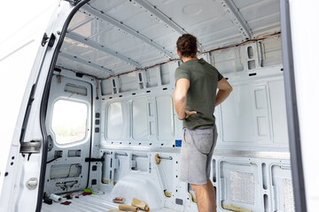 Man standing inside an empty van