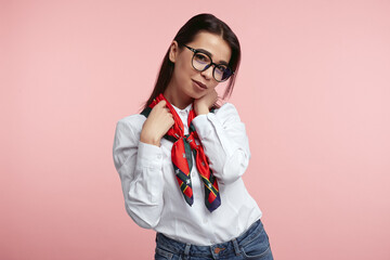 Girl wearing white shirt and eyeglasses, has happy expression