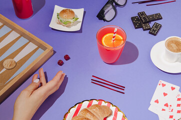 Creative layout made of dice, dominoes, backgammon, and playing cards. Colorful gaming background idea.