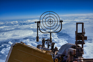 fragment of an anti aircraft machine gun, a round sight is aimed at clouds sky
