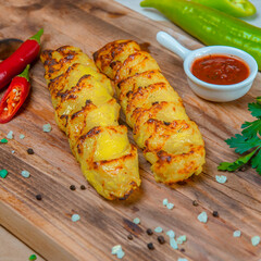 Potato Kebab With Hot Sauce On The Wooden Tray