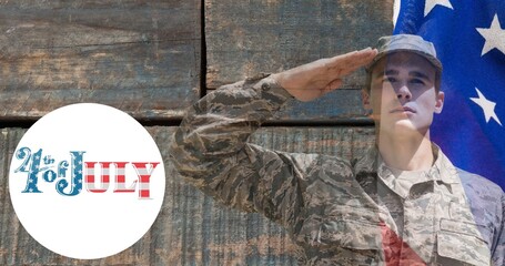 Composition of fourth of july text with saluting male soldier over american flag on wooden surface